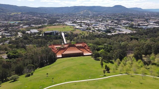 Aerial drone view of the Nan Tien Temple Buddhist complex in Berkeley, Wollongong, NSW Australia on a sunny day   