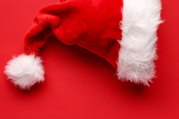 Fototapeta premium Santa hat on red background