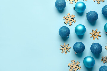 Christmas balls and wooden snowflakes on blue background