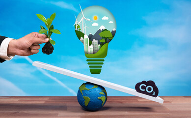 Businessman balance light bulb on scale with CO2 emission icon, demonstrate concept of ESG...