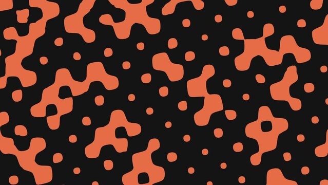 An eye catching pattern of black circles on an orange background creates a striking resemblance to the spots of a leopard