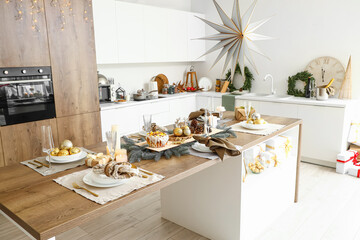 Dining table with Christmas setting in kitchen