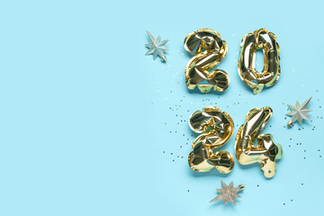 Golden foil balloons number 2024 and Christmas stars on blue background