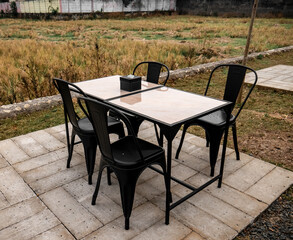 Dining table and chairs with an outdoor theme
