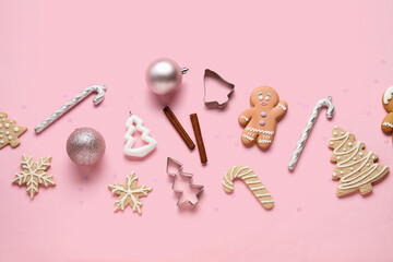 Composition with Christmas cookies and beautiful decorations on pink background