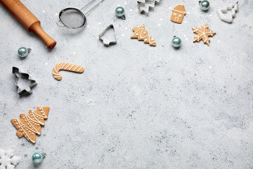 Composition with Christmas cookies, decorations and kitchen utensils on light background