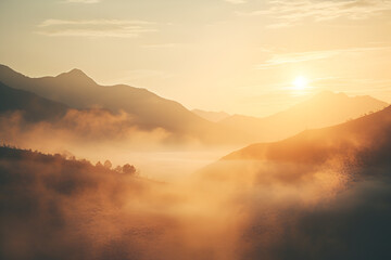 Obraz premium fog below the mountaintops, in the style of light yellow and orange, romantic soft focus