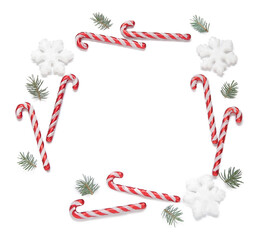 Frame made of candy canes and Christmas decorations on white background