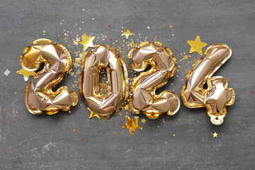 Composition with figure 2024 made of foil balloons on grey background