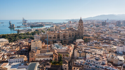 Aerial photo from drone to Alcazaba and Castle of Gibralfaro in the background a panoramic view of the city of Malaga and old town Malaga at sunset. Malaga,Costa del sol, Andalusia,Spain, (Series) - obrazy, fototapety, plakaty