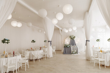 A view inside a marquee set up for a wedding reception. High quality photo
