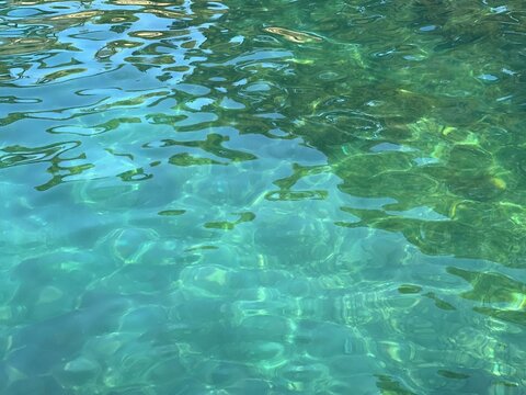 Transparent sea water surface turquoise blue glittering watercolor.