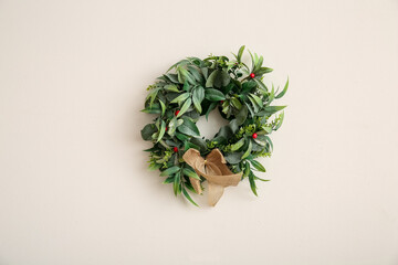 Beautiful mistletoe wreath on white background