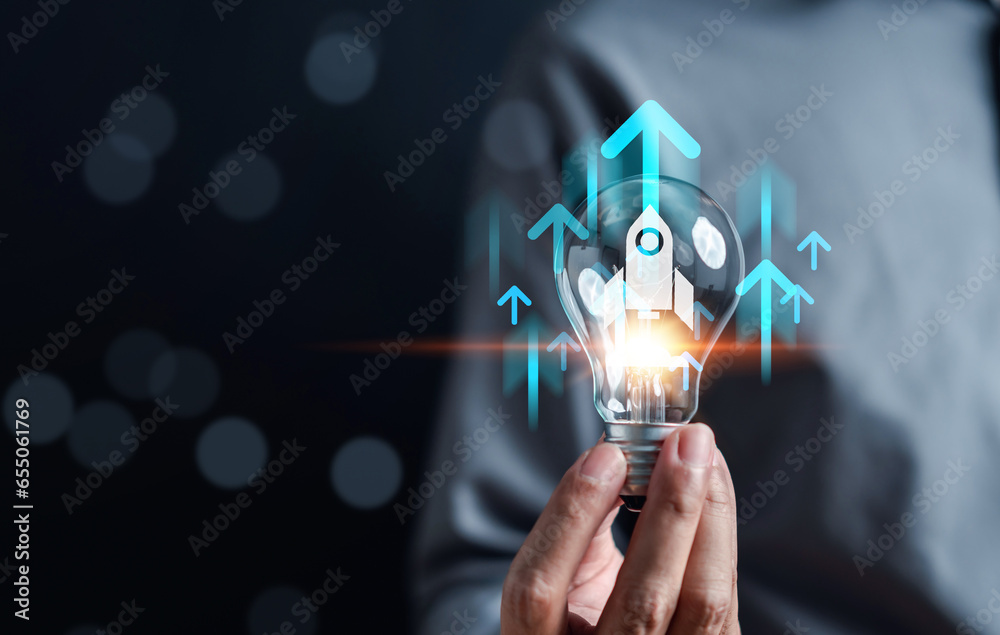 Aufkleber business growth journey of a rocket launch inside light bulb, arrow accelerate towards to goals, rap