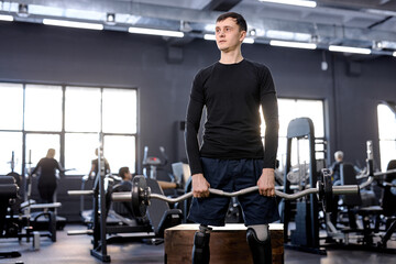 athletic motivated strong tired sportsman with artificial leg working out with barbell at gym, close up photo. free time, spare time, lifestyle