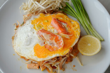 Close up signature Thai dish. Pad Thai is a local fried noodles with shrimp and tamarind sauce.