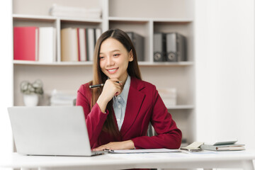 Asian people independent investment consultant captured in her element at office, donning vibrant...