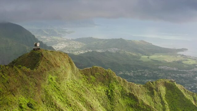 Dramatic views of Stairway to Heaven hike on Oahu island, Hawaii. Aerial view on top of Haiku Stairs. Tourist attraction on Oahu island. Epic green mountain peaks with steep ridge, vertical incline 4K