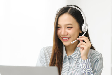 Asian people call center agent in serene work environment, expertly handling client issues via her laptop at organized workspace. representation of modern telecommunication pivotal role in business.