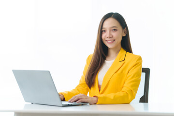 Confident female Asian china people advisor specializing in studying abroad, donning vibrant yellow suit, guiding students toward international education opportunities in global institutions.