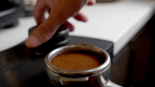levling coffee pouder to start making espresso
 closeup - (High quality colors)