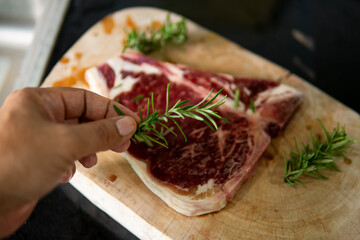 Close up hand chef cooking steak