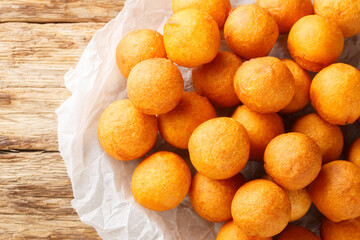 Fried sweet potato balls are a common Thai street sweet made predominantly from sweet potato and...