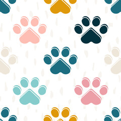 Paws or footprints of cats and dogs on a white background create a cute seamless pattern for fashion fabrics. Vector.