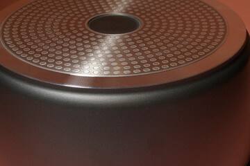 The lower surface of the cauldron is adjacent to the heated surface of the stove for using all...