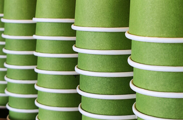 Closeup Stacked green paper drinking glasses -Abstract Background 