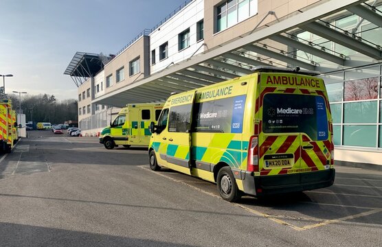 Chelmsford, UK - February 21, 2023: Ambulances parked outside Accident and Emergency department at Broomfield Hospital, Chelmsford, Essex, UK. 