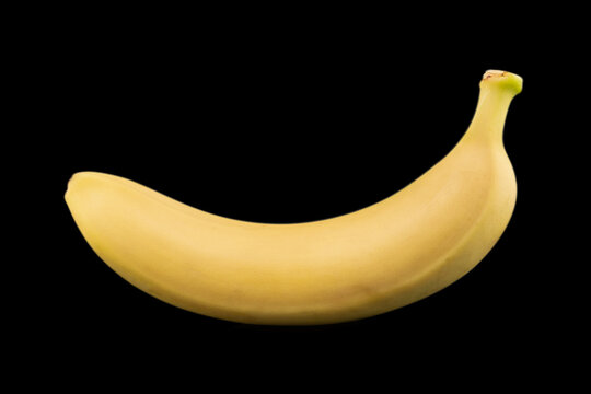 solated bananas. Banana fruit isolated on black mirror background. Ripe bananas with clipping path. Banana fruit close up. Banana isolated