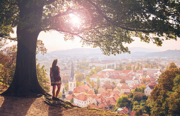 Female tourist enjoying sunset above city of ljubljana panoramic view- Slovenia