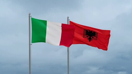 Italy flag and Albania flag waving together on cloudy sky, endless seamless loop