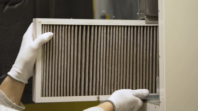 hvac filter replacing. Replacing the filter in the central ventilation system, furnace. Replacing Dirty Air filter for home central air conditioning system. Change filter in rotary heat exchanger