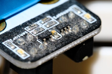 Dirty circuit board covered in dust