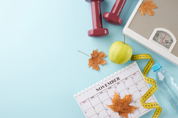 Fall fitness revitalization concept. Top view flat lay of calendar, dumbbells, floor scales,...