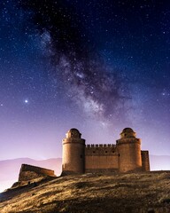 Calahorra castle with the Milky Way in the background. long exposure photo at night.
