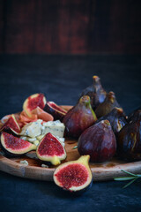 still life figs on a wooden plate