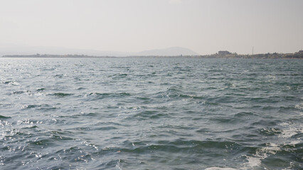 Slow motion Sevan lake low angle background with mountains on background