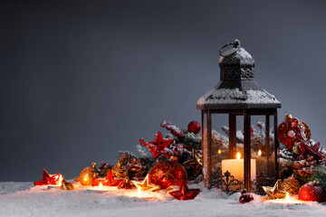 Christmas lantern and decor in snow