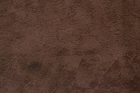 Dark terracotta mediterranean old wall plaster rough texture background