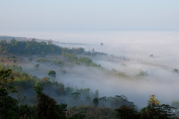 Beautiful Sunset and sunrise on sky and golden twilight time with mist and fog in valley of layer mountain