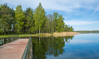 Fototapeta na wymiar Metal pontoon bridge on the lake Braslav , Belarus.