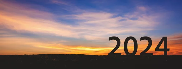 Draagtas New year 2024 with sunset sky background © Peera