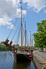 Naklejka na ściany i meble Historic Boat on the River Trave in Lübeck