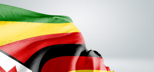 Zimbabwe national flag cloth fabric waving on beautiful sky Background.