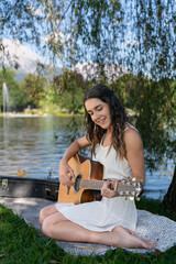 young girl gigging next to a lake