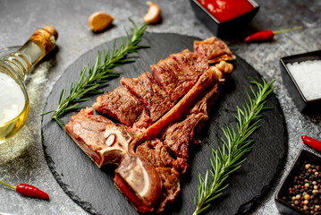Grilled T-bone steak on stone background