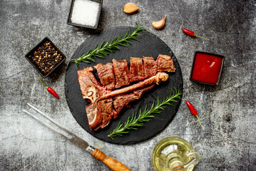 Grilled T-bone steak on stone background